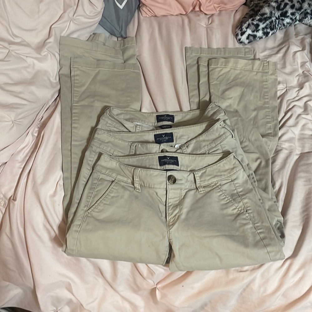 3 pairs of American eagle kick boot kahki pants.